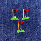 Three embroidered golf flag patches with number 19 on a denim background