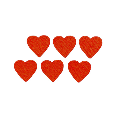 Six red heart-shaped patches on a white background