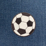 Soccer ball patch on a denim background