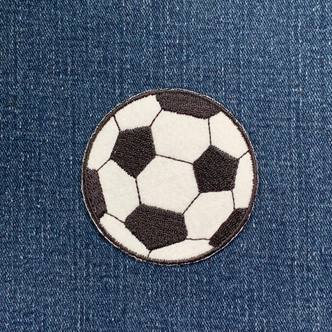 Soccer ball patch on a denim background
