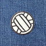 Volleyball patch on a denim background