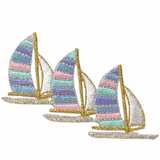 A patch with three sailboats applique design in multicolor.