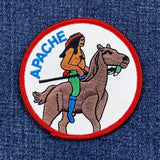 Patch of a Native American rider on a horse with 'Apache' text on a denim background