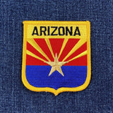 Arizona state flag patch on a denim background