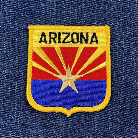 Arizona state flag patch on a denim background