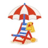 Embroidered patch of a beach scene with an umbrella and chair on a white background
