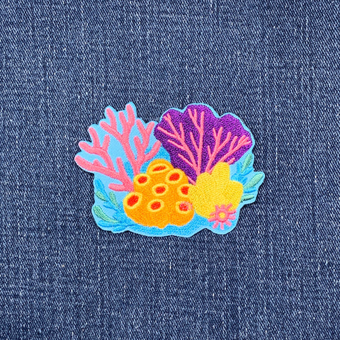 Colorful coral patch on denim fabric