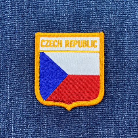 Embroidered patch of the Czech Republic flag on a blue denim background
