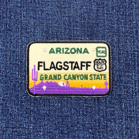 Patch with 'Flagstaff, Arizona, Grand Canyon State' text on a denim background