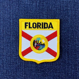Florida state flag patch on a blue denim background