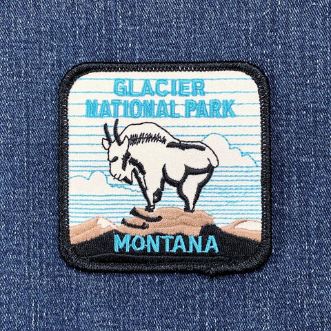Embroidered patch of Glacier National Park, Montana on a denim background