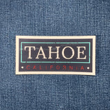 Denim fabric with 'TAHOE CALIFORNIA' sticker on top