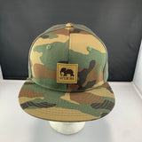 Camouflage baseball cap with a LET'S BE IRIE logo
