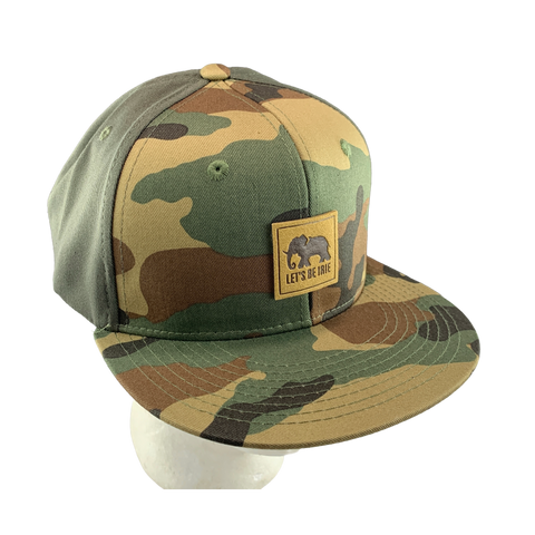Camouflage baseball cap with a LET'S BE IRIE logo on a white background