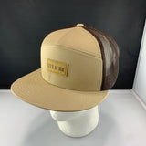 Beige cap with brown mesh and 'Let's Be Irie' patch on a black background