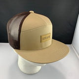 Beige cap with brown mesh and 'Let's Be Irie' patch on a black background