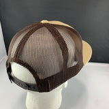 Beige cap with brown mesh and 'Let's Be Irie' patch on a black background