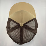 Beige cap with a black mesh front on a light gray background