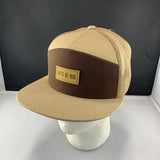 Beige and brown cap with 'Let's Be Irie' logo on a black background