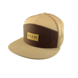 Beige and brown cap with a LET'S BE IRIE logo on a white background