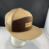 Beige and brown cap with 'Let's Be Irie' logo on a black background
