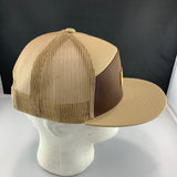 Beige and brown cap with 'Let's Be Irie' logo on a black background