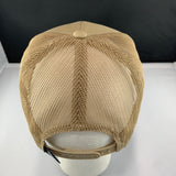 Beige mesh cap on a white stand with a black background