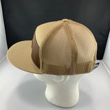 Beige and brown mesh cap on a mannequin head against a black background