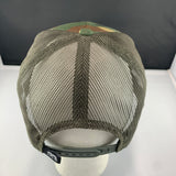 Green mesh cap on a mannequin head with a plain background