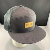 Gray cap with a 'Let's Be Irie' patch on a black background