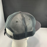 Gray mesh cap on a mannequin head with a plain background