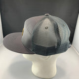 Gray mesh cap on a mannequin head against a black background