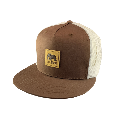 Brown and white cap with a 'Let's Be Irie' patch on a white background