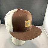 Brown and white cap with a 'Let's Be Irie' patch on a black background