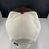 White mesh cap with brown top on a white surface