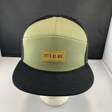 Loden and black cap with a "Let's Be Irie" patch on a black background
