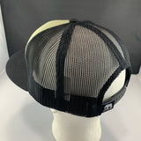 Black mesh trucker cap on a mannequin head with a gray background