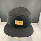 Black mesh cap with a 'Let's Be Irie" patch on a black background