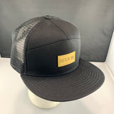 Black mesh cap with a 'Let's Be Irie" patch on a black background