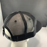 Black mesh cap on a mannequin head with a plain background