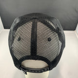 Black mesh cap on a mannequin head with a gray background