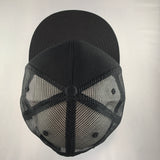 Black baseball cap with mesh back on a light gray background