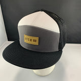 Gray white and black cap with a beige 'Let's Be Irie' patch on a black background