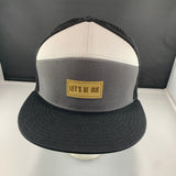 Gray white and black cap with a beige 'Let's Be Irie' patch on a black background