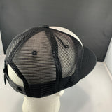 Gray white and black cap on a black background