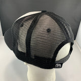Black mesh cap on a mannequin head with a visible brand logo against a gray background