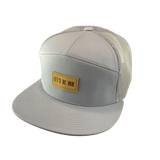 Gray cap with a beige 'Let's Be Irie" patch on a white background
