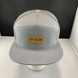 Gray cap with a beige 'Let's Be Irie" patch on a black background