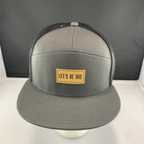 Gray cap with a 'Let's Be Irie' patch on a black background
