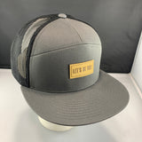 Gray cap with a 'Let's Be Irie' patch on a black background